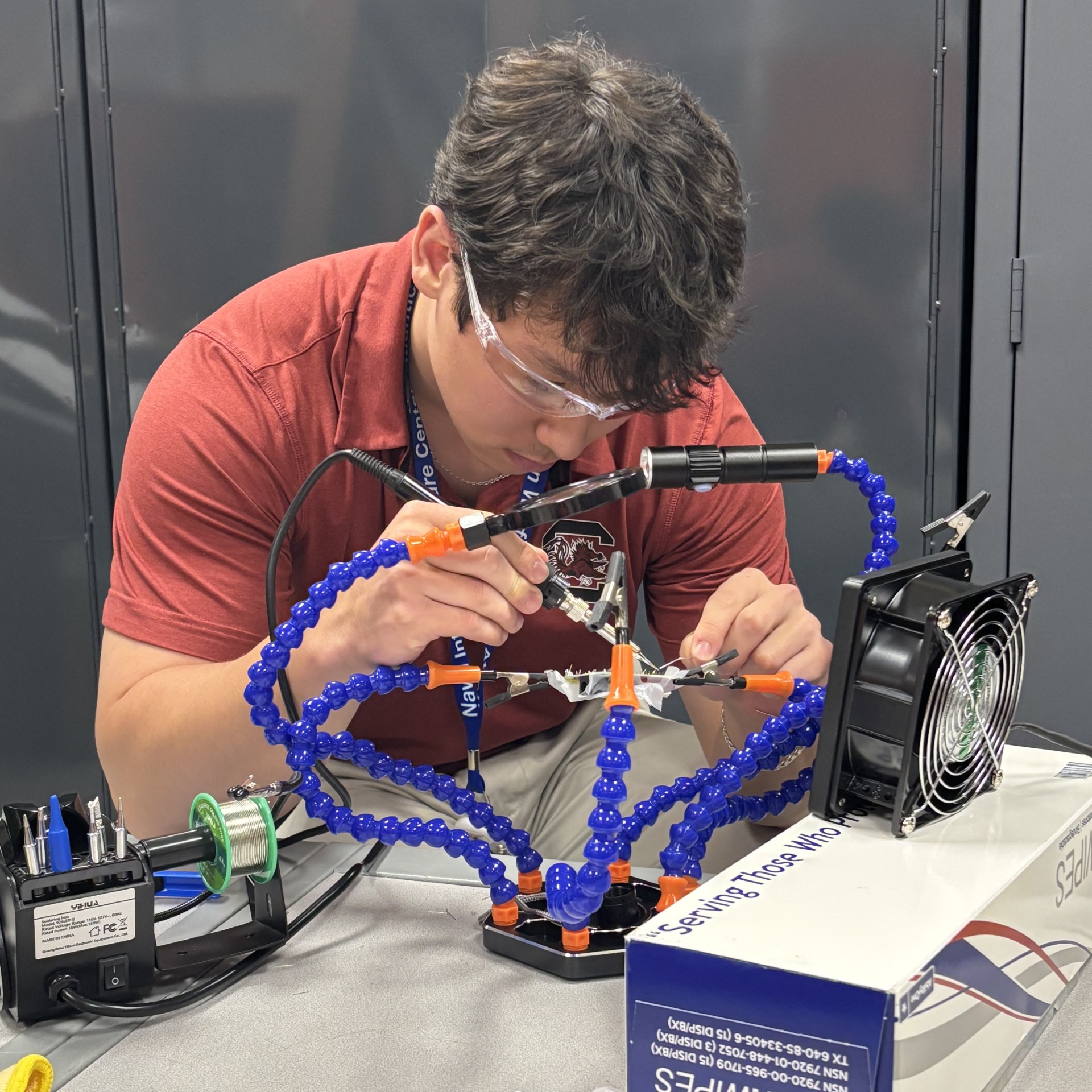Justin soldering a board